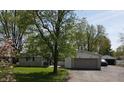 Charming ranch-style house with attached garage, brick facade, and well-maintained front yard at 1029 Price Rd, Avon, IN 46123