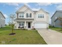 Charming two-story home with a well-manicured lawn, brick accents, and attached two car garage at 10810 Arendale Dr, Brownsburg, IN 46112