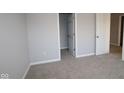 Cozy bedroom with neutral walls and soft carpet at 1114 Ridgevine Rd, Greenwood, IN 46143