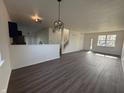 Bright living room with modern wood floors, neutral walls, and an open floor plan at 1539 Egret Ln, Greenwood, IN 46143