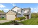 Charming two-story home with a brick-accented garage and well-maintained lawn at 2020 Tourmaline Dr, Westfield, IN 46074