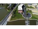 Aerial shot of complex near waterfront, with beautiful landscaping and parking at 20971 Shoreline Ct # 305, Noblesville, IN 46062