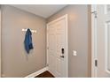 Inviting entryway with coat rack and neutral walls, leading into the home at 20971 Shoreline Ct # 305, Noblesville, IN 46062