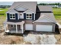 An aerial view of an elegant two-story home with a two-car garage at 210 Aster Way, Greenfield, IN 46140