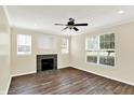 Inviting living room featuring wood floors, neutral walls, and a fireplace at 2270 Brightwell Pl, Indianapolis, IN 46260