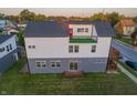 Aerial shot of the back exterior with a modern design, a small deck, and a gray and white color scheme at 2302 Prospect St, Indianapolis, IN 46203