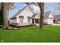 Beautiful exterior of a home with nice landscaping, large trees, and a well maintained lawn at 2428 Hawthorn Pl, Noblesville, IN 46062