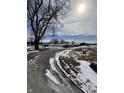 Exterior view featuring a long driveway and open outdoor space, with visible outbuildings and a bright sky at 3333 S Sr 9, Greenfield, IN 46140