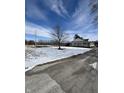 Charming home with a covered porch, set on a partly snow covered lot under a bright sky at 3333 S Sr 9, Greenfield, IN 46140
