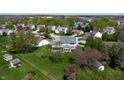 An aerial view of a neighborhood with mature trees and well-maintained lawns at 4243 Bay Leaf Cir, Indianapolis, IN 46237