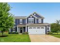 Beautiful two-story home with a well-maintained lawn, manicured landscaping, and a two-car garage at 4245 W Fork Dr, Westfield, IN 46062