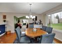Cozy dining room with hardwood floors, stylish chairs, and lots of natural light at 4511 Hunt Master Ct, Indianapolis, IN 46268