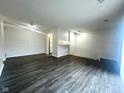 Spacious living room with hardwood floors, great light, and ceiling fan at 6458 Lupine Ter, Indianapolis, IN 46224