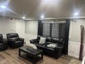 Cozy living room with leather furniture, modern decor, and ample space for relaxation and entertaining at 7206 Halden Pl, Indianapolis, IN 46214