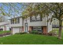 Charming split-level home with attached garage and front yard at 9034 Caminito Ct, Indianapolis, IN 46234
