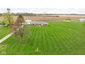 Wide shot of home with massive green lawn and mowed stripes at 10239 Wilson Rd, Brownsburg, IN 46112