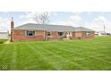 Close up of brick ranch home with large front yard at 10239 Wilson Rd, Brownsburg, IN 46112