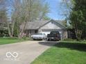 Charming one-story home with attached garage and inviting front yard at 1080 W Wildflower Ct, Mooresville, IN 46158