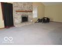 Spacious living room featuring a brick fireplace and abundant natural light at 1080 W Wildflower Ct, Mooresville, IN 46158