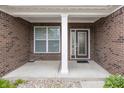 Welcoming front porch showcasing brick pillars and decorative glass front door at 14014 Fieldcrest Dr, McCordsville, IN 46055