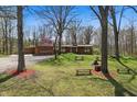 Beautiful backyard featuring an outdoor seating area and mature trees at 16632 Oak Rd, Westfield, IN 46074
