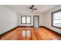 Bright and airy living room featuring beautiful hardwood floors and new windows at 2034 Mansfield St, Indianapolis, IN 46202