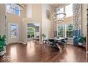 Elegant dining room with high ceilings, large windows, and wood floors providing an open and inviting space at 2705 April Springs View, Carmel, IN 46074