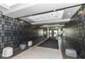 Modern building lobby with decorative walls, tile flooring, and modern furniture at 333 Massachusetts Ave # 303, Indianapolis, IN 46204