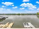 Breathtaking lake view from the property with private docks and boats, ideal for water activities at 3646 Beach Blvd, Cicero, IN 46034