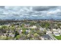 An aerial view captures the cityscape nestled among the trees and suburban houses at 433 Jefferson Ave, Indianapolis, IN 46201