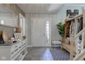 Inviting home foyer featuring stylish console table, wood accent bench, and tasteful decor at 4977 Beechwood Rd, Avon, IN 46123