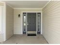 Charming front door with sidelights and a modern black finish at 5007 Avian Ln, Indianapolis, IN 46235