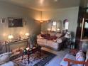 Inviting living room with plush seating, decorative pillows, and tasteful décor under soft lighting at 6040 Ipswich Ct, Indianapolis, IN 46254
