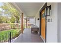 Inviting front porch with comfortable seating, perfect for relaxing outdoors at 611 Tecumseh St, Indianapolis, IN 46201