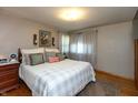 Cozy bedroom featuring a comfortable bed, soft lighting, and stylish decor at 614 Debra Ln, Indianapolis, IN 46217