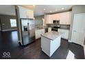 Modern kitchen features granite countertops, stainless steel appliances, and a stylish island at 6157 Winthrop Ave, Indianapolis, IN 46220