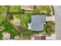 Aerial view of a home with a spacious backyard, patio, storage shed and well-maintained lawn at 6159 Connie Ct, Indianapolis, IN 46237