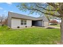 Inviting home with a clean exterior, manicured lawn, and a functional two-car garage at 6159 Connie Ct, Indianapolis, IN 46237