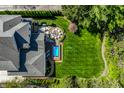Aerial view of a house with a pool, backyard, and garden at 7602 N Pennsylvania St, Indianapolis, IN 46240