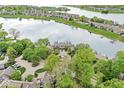 Gorgeous lakeside townhome community with lush trees and scenic water views, offering a serene living environment at 7786 Harbour Isle, Indianapolis, IN 46240