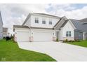 Beautiful two-story home featuring a three-car garage and a meticulously maintained front yard at 8654 Tripp Rd, Pendleton, IN 46064