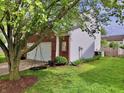 View of the two-car garage and fenced yard, offering both practicality and privacy in this outdoor space at 9099 Merrill Ct, Fishers, IN 46038