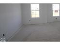 Bedroom with large windows, offering lots of natural light and providing a cozy retreat for relaxation at 10145 Redwood Peak Ln, Indianapolis, IN 46259