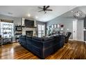 Spacious living room featuring a stone fireplace, hardwood floors, and ample natural light at 106 W Delaware St, Fortville, IN 46040