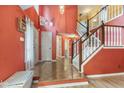 Welcoming foyer with high ceilings, staircase, and front door at 12449 Huntington Dr, Indianapolis, IN 46229