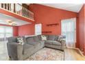 Cozy living room with a large sectional sofa and plenty of natural light at 12449 Huntington Dr, Indianapolis, IN 46229