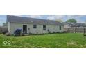 Spacious backyard features a small shed and a wood fence for added privacy at 1370 Ash Ct, Martinsville, IN 46151