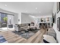Bright open-concept living room with hardwood floors, modern decor, and natural light at 1702 Alvord St, Indianapolis, IN 46202