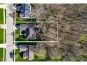 Aerial view of property showing its location in a neighborhood with mature trees and proximity to surrounding streets at 17027 Rainier Cir, Westfield, IN 46062