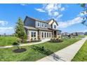 Charming two-story home featuring a well-kept lawn and inviting pathway to the front door at 19492 Lewis Cir, Westfield, IN 46074